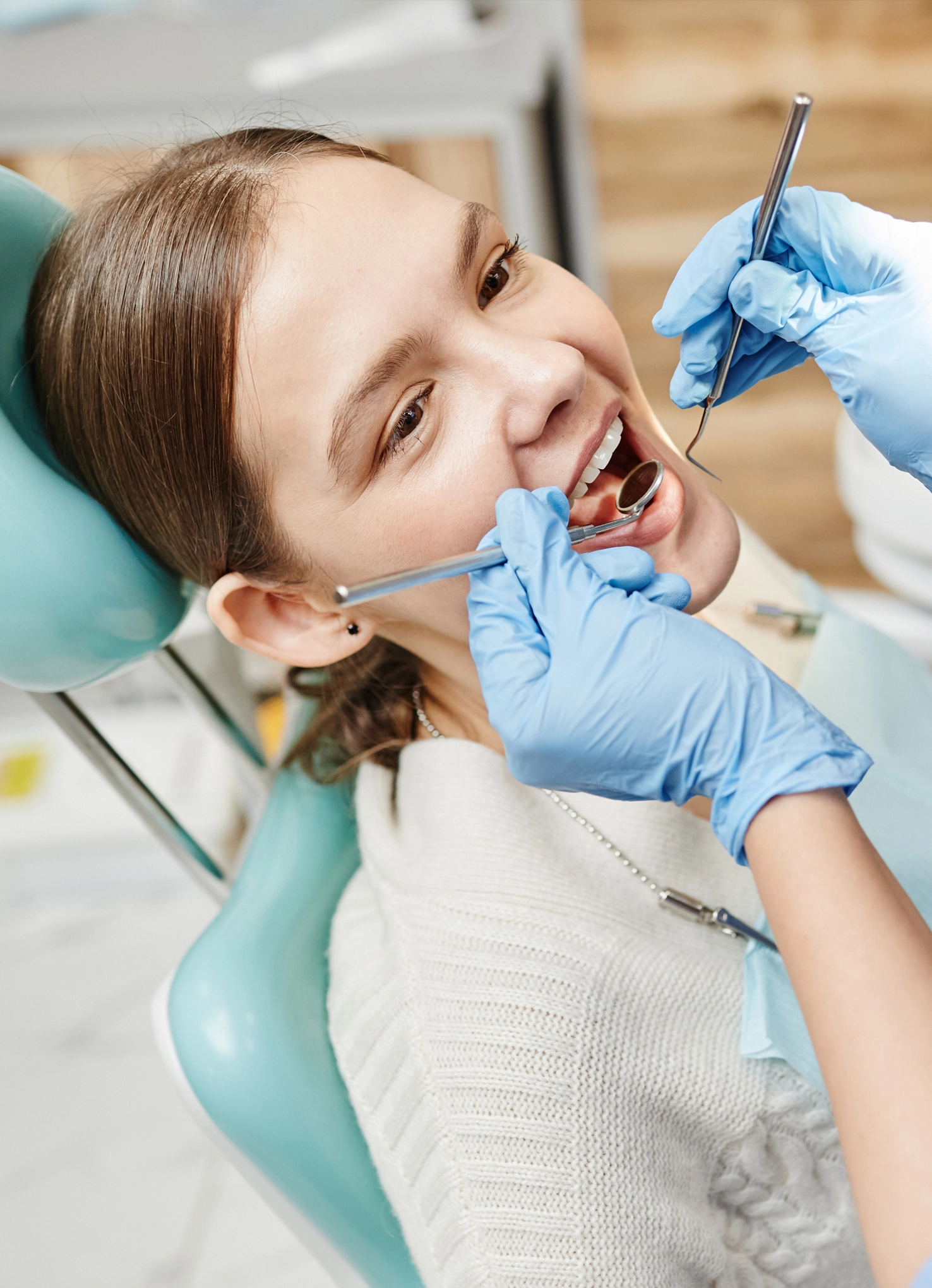 Dentist and assistant preparing treatment room